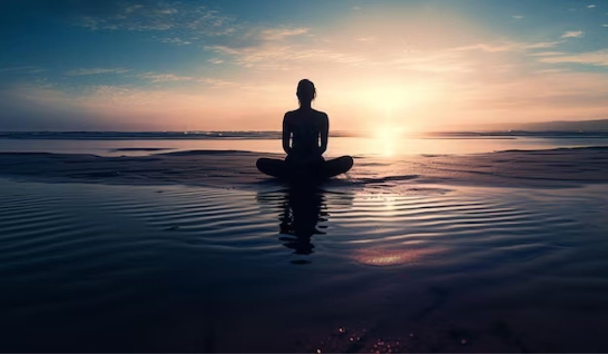 A person sitting in the water on top of an ocean.