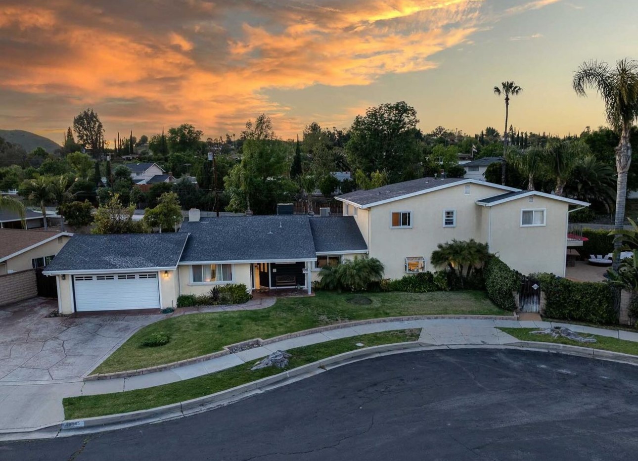 A house with a lot of trees in the background