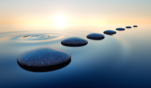 A group of stepping stones in the water.